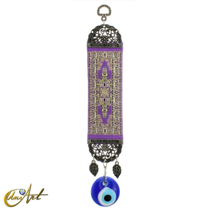 Evil Eye amulet with purple carpet background.