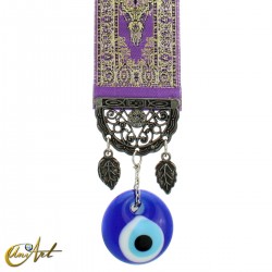 Amuleto ojo turco con alfombra base violeta.