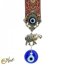 Turkish evil eye with elephant and red carpet