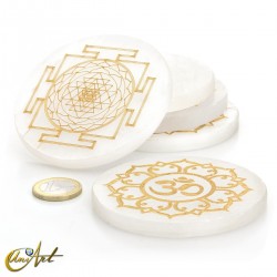 Selenite disc with Buddhist symbol