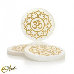 Selenite disc with Buddhist OM symbol