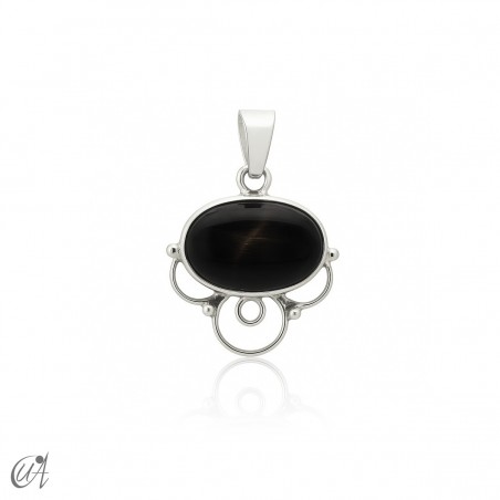 Nuit pendant in sterling silver with oval natural black star