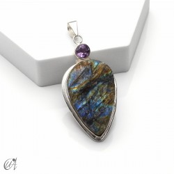 Silver pendant with rough labradorite and faceted gemstone