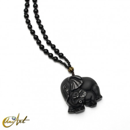 Carved obsidian elephants with necklace