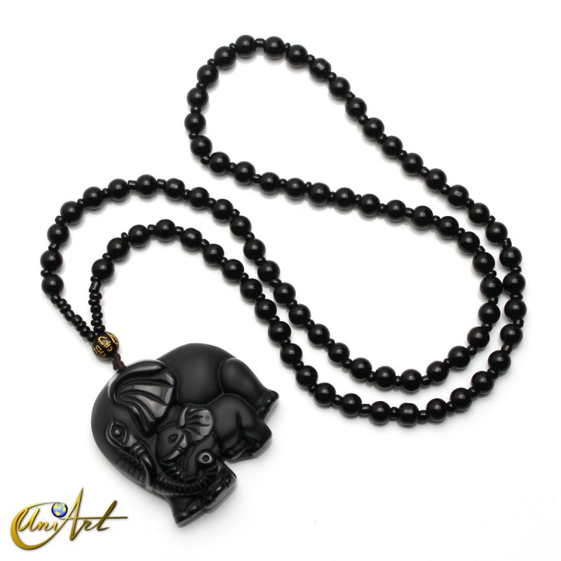 Carved obsidian elephants with necklace